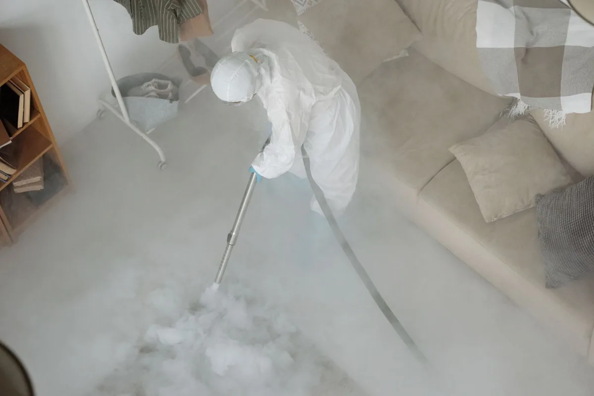 Biohazard cleanup technician in protective equipment, Gatesville, TX